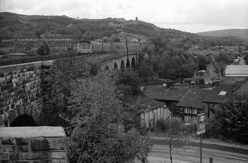 4 October 1984 and a two-car Class 108 crosses the viaduct slowing for its stop at Todmorden Station Platform 1 with a service bound for Manchester Victoria