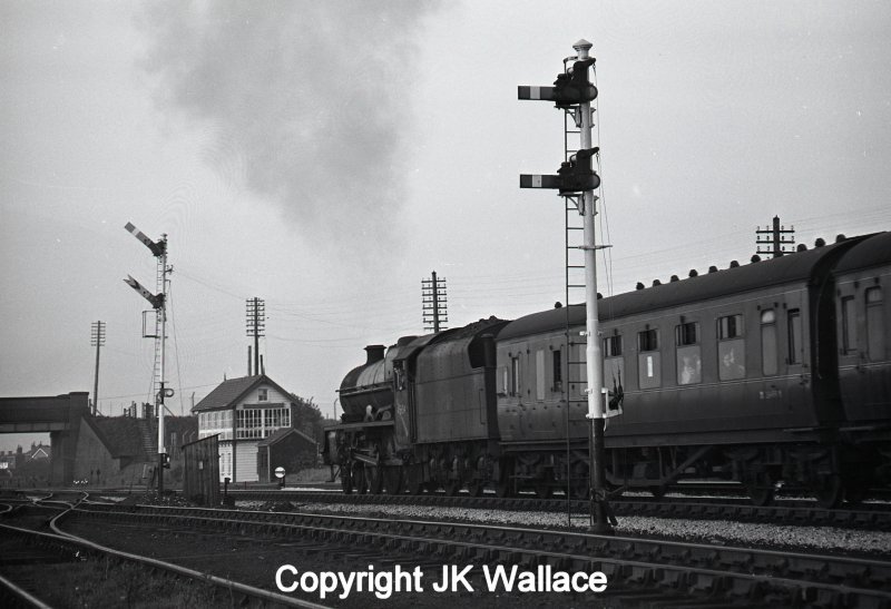 LMS Stanier Jubilee 45654 'Hood' leaving Westhoughton with 1T44, a returning advertised excursion from Southport Chapel Street to Manchester Victoria at 20.39 on Saturday 28 May 1966. Westhoughton Signal Box is visible in the background.