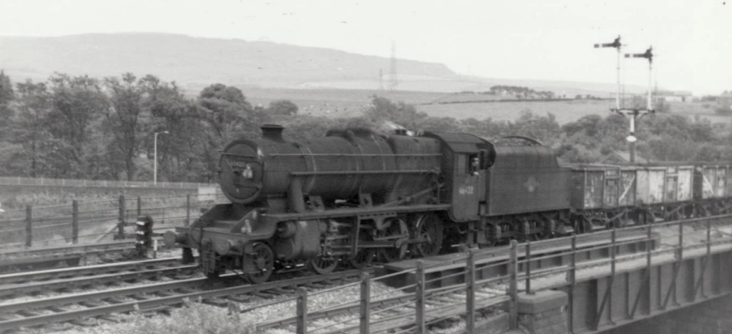 A close-up of Stanier 8F 48423 approaching Rose Grove with a train of empty mineral wagons off the Accrington line on 22 July 1968.