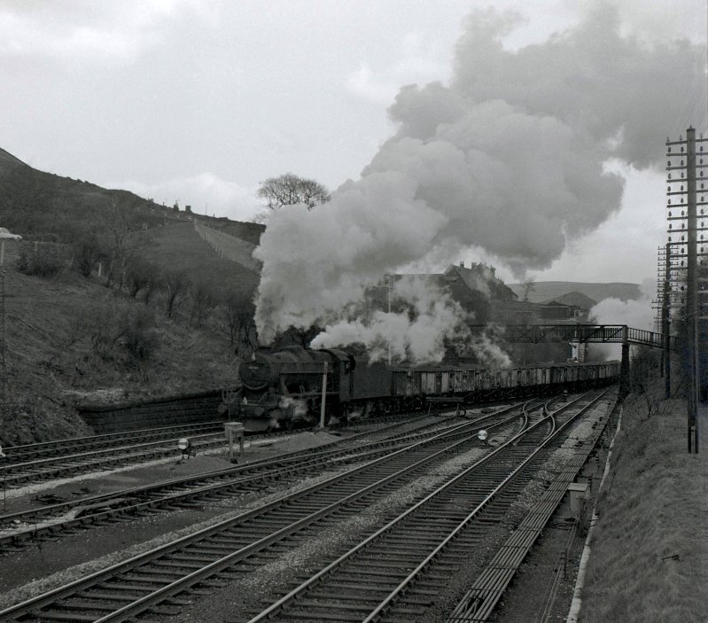 48701 exits Millwood Tunnel and turns for Copy Pit and Rose Grove with a laden coal train sometime between late 1965 and August 1968...