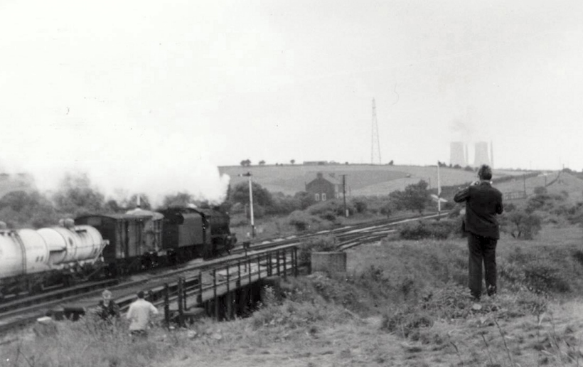 Stanier 8F departs westwards from Rose Grove with a freight train (6P32) at 13.10 hrs to Wyre Dock, near Fleetwood, on 22 July 1968.