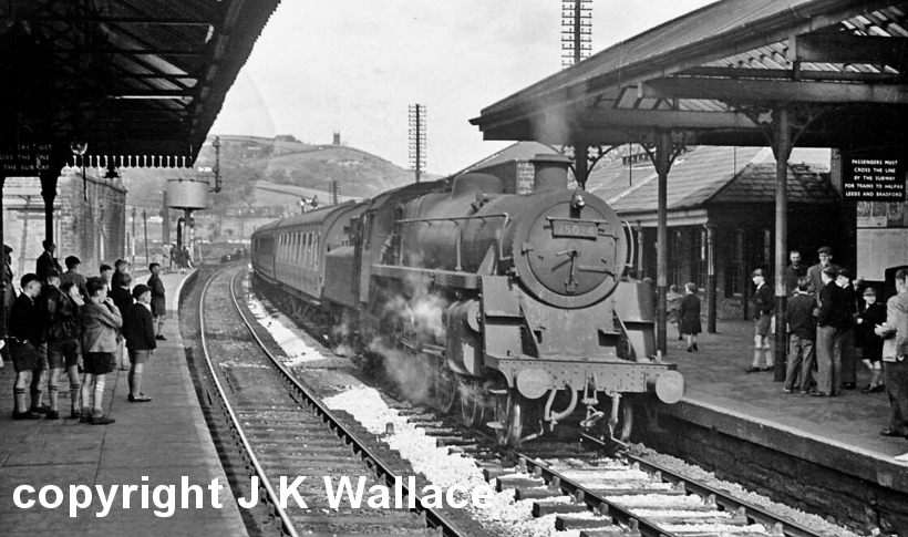 BR Standard Class 5 75034 enters Todmorden station some tome in the 1950s with a passenger train heading towards Manchester.