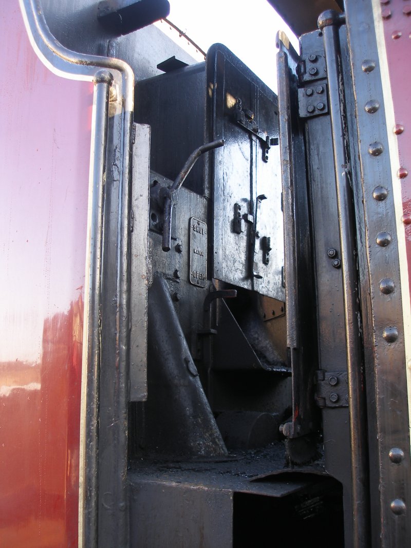 ex-LMS Stanier 8F 2-8-0 48624 as seen at the Great Central Railway, Loughborough on 30 December. Detail of cab door, fireman's side.