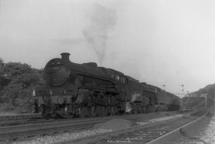 Stanier Jubilee 45581 'Bihar and Orissa' and Black 5 45428 approaching Anchor Pit from Bradley Wood with the evening Red Bank empty newspaper vans in 1963. 