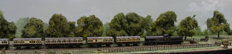 Guy William's Aylesbury (18.2mm gauge) showing the goods yard headshunt as it passes along Stocklake, complete with passenger train and loco 'parked up'.
