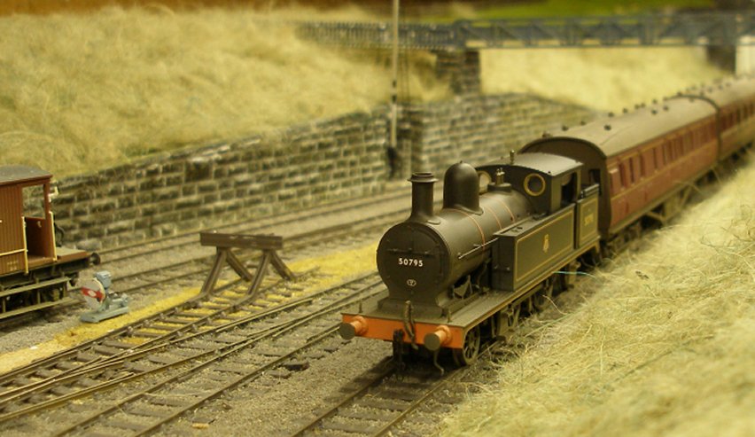 Bachmann 2-4-2T Radial Tank 50795 rolls towards Todmorden and Manchester on the Up Calder Valley main line. Alkthough shedded at Manningham on the outskirts of Bradford, this particular loco is unlikely to have worked such services, despite the Calder Valley running into Bradford.