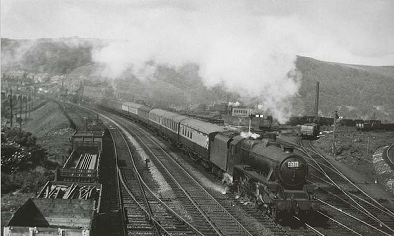Black 5 approaches Hall Royd Road bridge with a train of Gresley carriages in the early 1950s red and cream livery