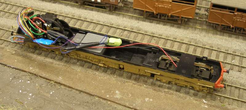 Hornby Class 110 DMU re-motoring project:  the original chassis showing Hornby wheels and traction tyres (left) and Ultrascale (right) on the unpowered bogie with extra lead in front of the motor bogie