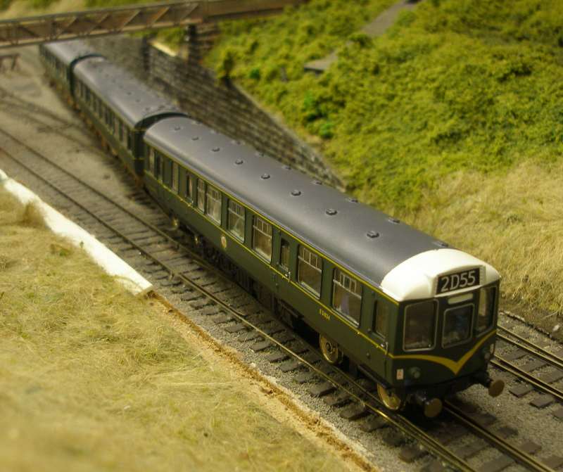 Hornby Class 110 DMU re-motoring project: new chassis with both Black Beetles fitted, and body clipped back out on trials without bogie sideframes.