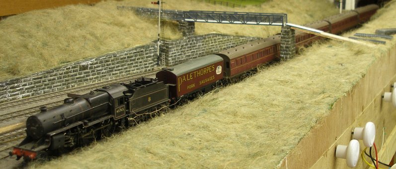 Bachmann Crab heads west with an empty six-wheel Palethorpe's sausage van at the head of a local consist at Hall Royd Junction. The van will probably be detached at Rochdale to be tripped forward to Stockport and Crewe before heading for Wolverhampton High Level and Dudley.