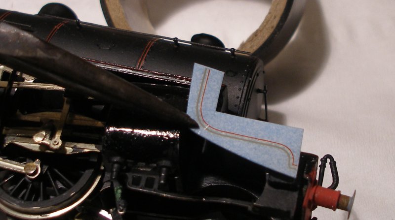 DJH Crab: The Fox lining transfer is securely held with a pair of pliers and laid on the footplate edging.
