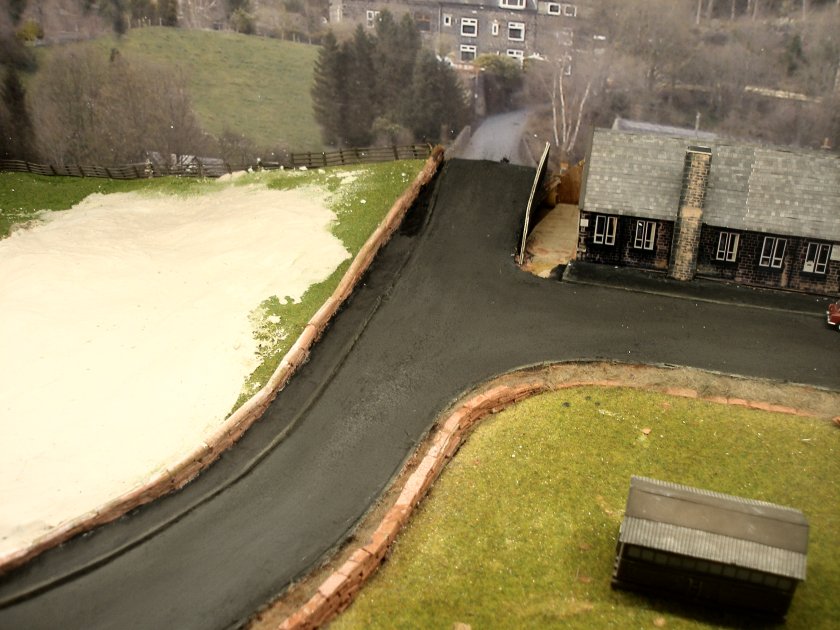Construction of a 4mm model road: final rubbed down, varnished and weathered road surface