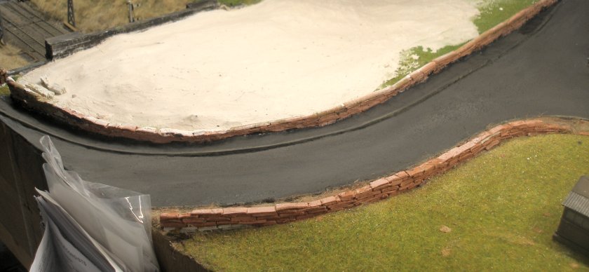 Construction of a 4mm model road: final rubbed down, varnished and weathered road surface