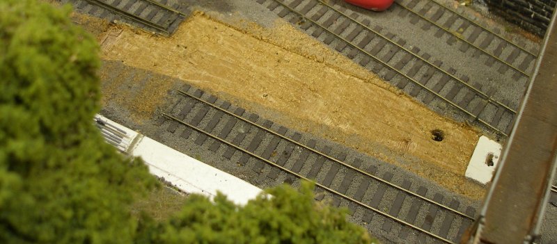 Hall Royd Junction model railway layout: the rail height of the new points is too high, and the underlay is now cut away.