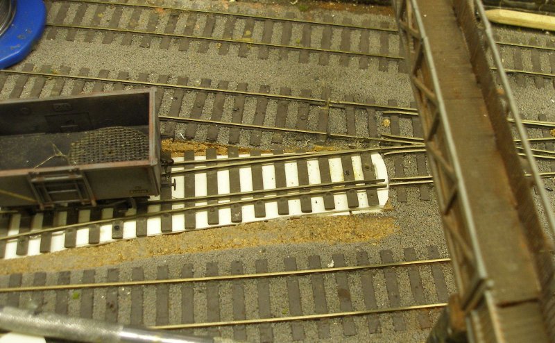 Hall Royd Junction model railway layout: the rail height of the new points is too high, and the underlay is now cut away and a plasticard inlay inserted.