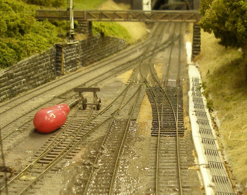 Hall Royd Junction model railway layout: the rail height of the new points has now been adjusted, and another section of plain track is now also being upgraded.