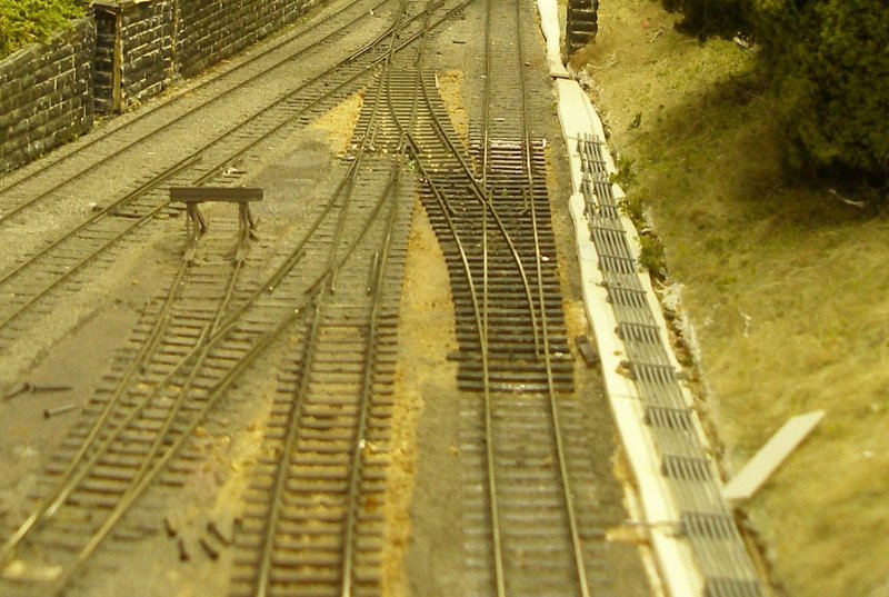 Hall Royd Junction model railway layout: the rail height of the new points has now been adjusted, and another section of plain track is now also being upgraded.