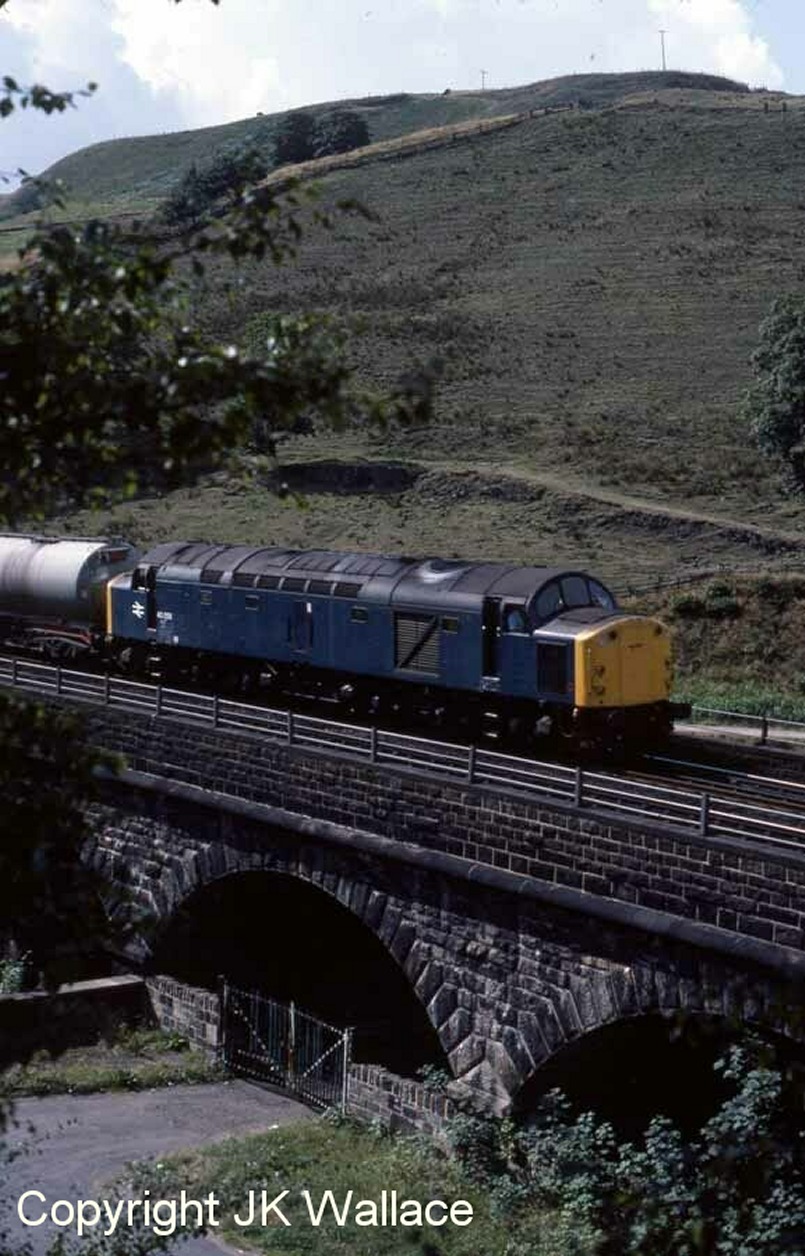 Gauxholme viaduct with BR Class 40 40058 heading a train of oil tankers over it towards Todmorden on 22 August 1983.