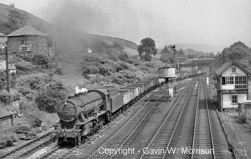 Riddles 'WD' class 2-8-0 No. 90181 with a westbound coal freight taking the Copy Pit route
at Hall Royd Junction, Todmorden on 14 June 1961, copyright Gavin W Morrison.