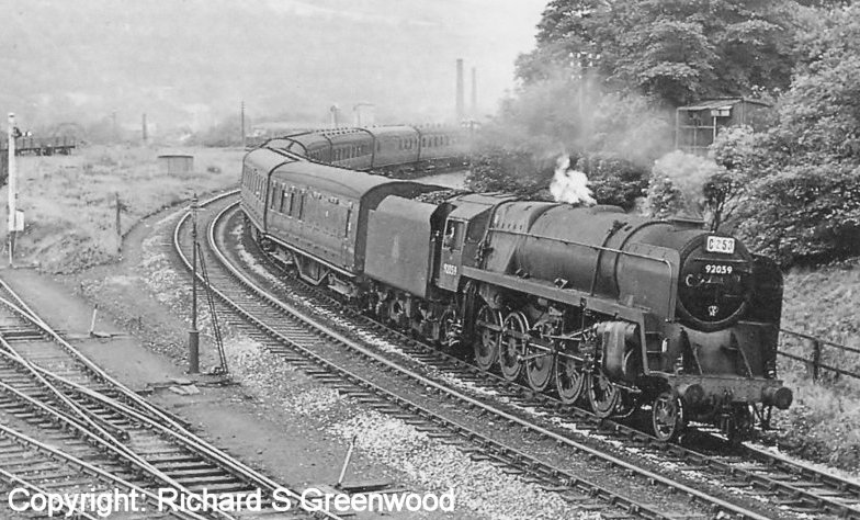 BR Standard 9F 92059 wheels a Saturday's only service from Blackpool and heading for Yorkshire under Hall Royd Road bridge on 6 August 1960.