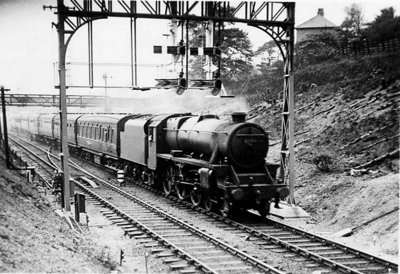 Hall Royd Junction c. 1937 showing a passenger train heading for Yorkshire pulled by Stanier Black 5 5212 and passing under the gallows signal.