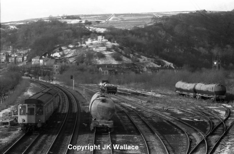 Hall Royd Junction engineering sidings with three surviving tankers dragged down from Summit Tunnel following the fire as sen in January 1985.