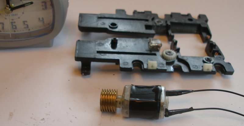 Bachmann Jubilee with Buelher motor conversion to DCC. There are two small springs that connected with the motor terminals, and these should be removed. The soldered terminals are now covered in insulation tape or similar.