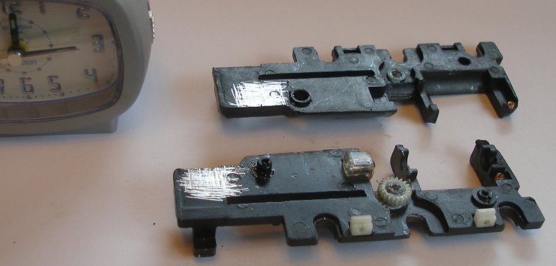 Bachmann Jubilee with Buelher motor conversion to DCC. At the other end of the chassis, the insides of the two frame halves are scraped down to clean metal.