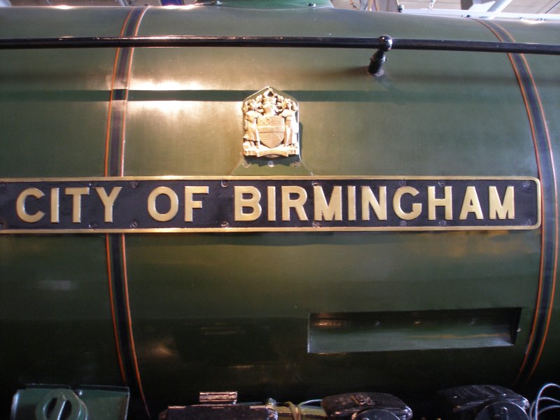 Stanier 'Coronation' Pacific 46235 'City of Birmingham' as seen in the ThinkTank Museum on 10 October 2015, showing nameplate and shield.