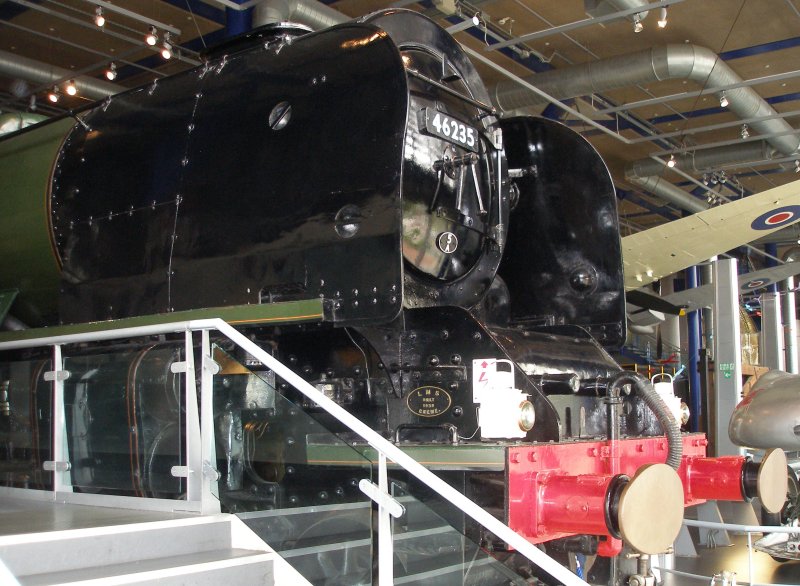 Stanier 'Coronation' Pacific 46235 'City of Birmingham' as seen in the ThinkTank Museum on 10 October 2015.  Three quarters view from front, showing smokebox and smoke deflector details, Fireman's side.
