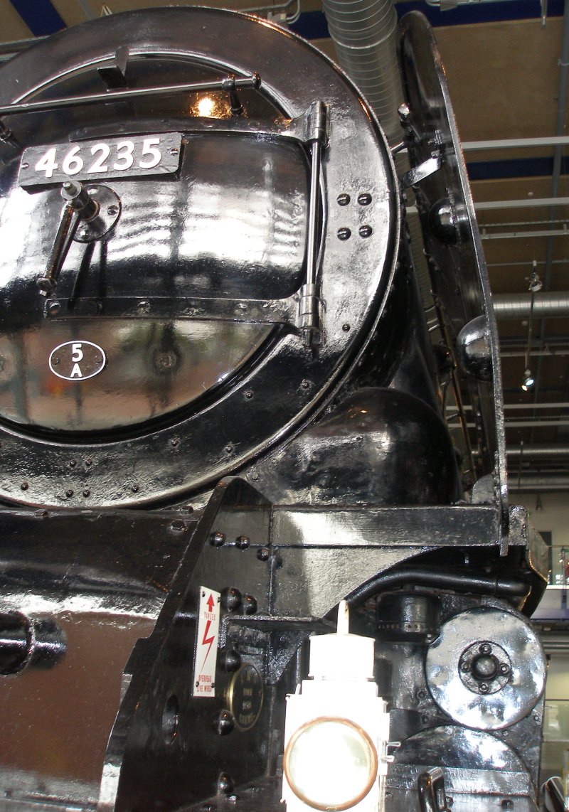 Stanier 'Coronation' Pacific 46235 'City of Birmingham' as seen in the ThinkTank Museum on 10 October 2015, showing the smokebox front and inside view of the driver's smoke deflector.