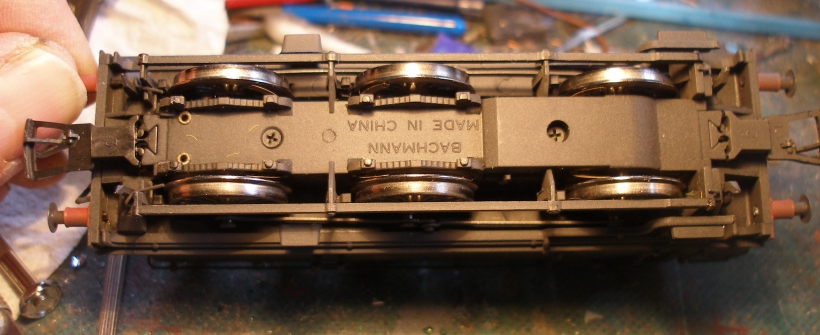 Underside of Bachmann Pannier showing couplings and screws all in postion, prior to removing the body