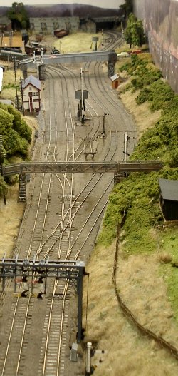 The 4mm scale (1:76) model railway layout of Hall Royd Junction on 3 October 2022, showing bridge signal box and signals in place
