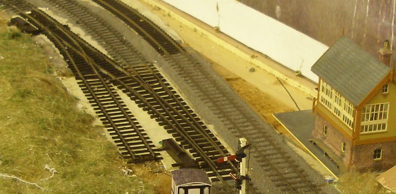 PECO Streamline Bullhead OO scale Code 75 Unifrog point (turnout) in situ on a layout showing it alongside C&L (left) and SMP track (right). Signal box by Peter Leyland and modelled on Kirkby.
