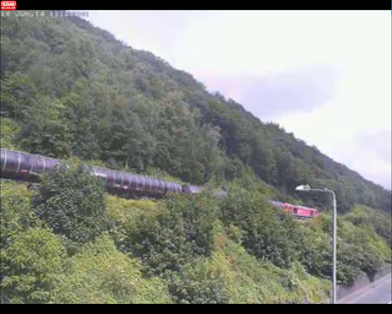 Screengrab from Railcam's installation at Eastwood, showing 683J, the ex-0855 Preston Docks Lanfina to Lindsey Oil Refinery train at 11:24 on Wednesday 18 June 2014.