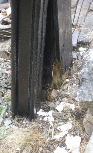 Base of Raynar Wilson signal post at Llanuwchllyn Station, 16 July 2015 showing reinforcement with old rails.