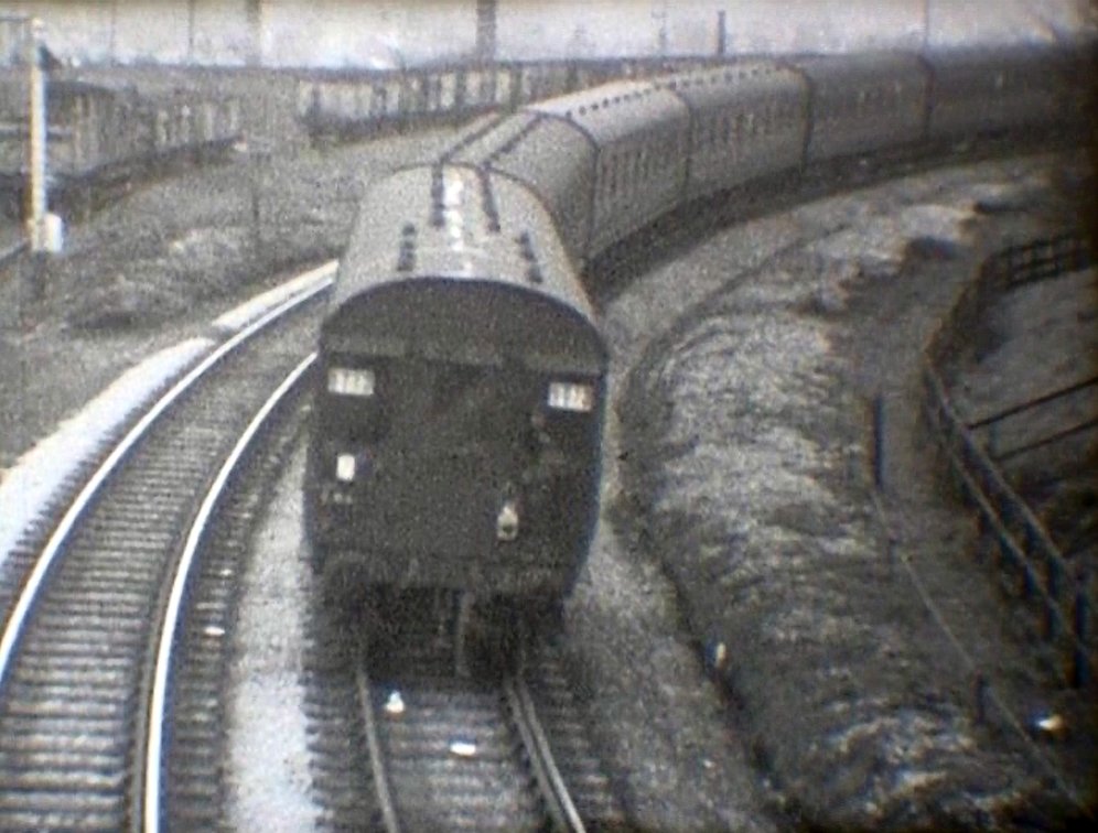 Crab propels the empty excursion stock towards Hall Royd Road birdge on the second side of the triangle, having reversed over the trailing cross-over at Stansfield Hall Junction courtesy 'Steam World' TeleRail video and Richard Greenwood.