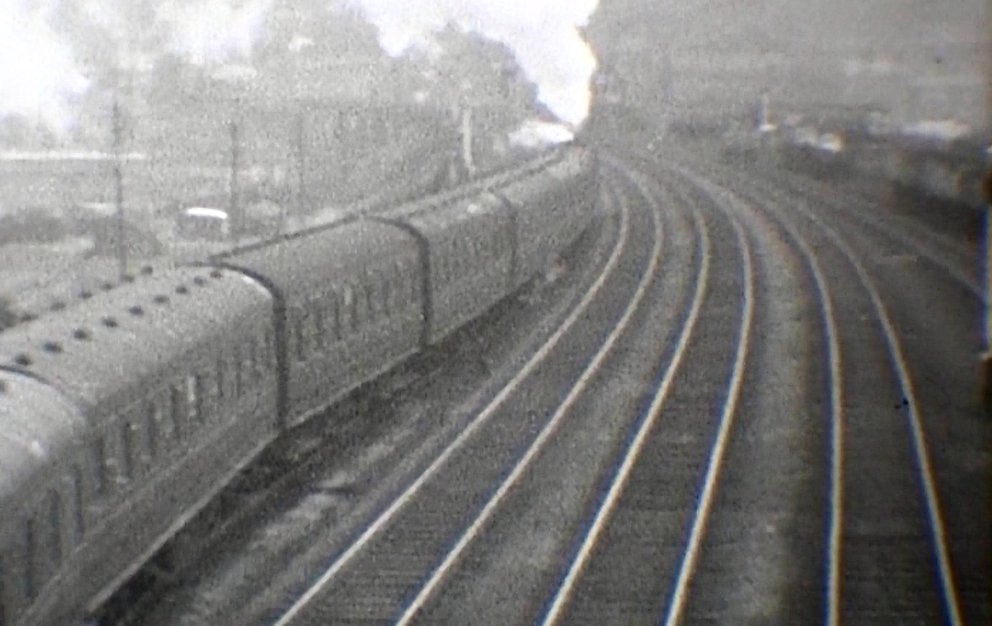 The train now passes back under Hall Royd Road bridge and then enters the Up passenger loop. Presumably it would then be held in this loop waiting time, and allowing booked services to pass, before moving down to Todmorden station. Courtesy 'Steam World' TeleRail video and Richard Greenwood.