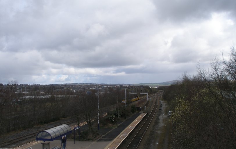 Rose Grove Railway Station looking north on Sunday 23 March 2014 with a Permanent Way train standing on the loop ready for the start of the Colne branch relaying due to start the next weekend.