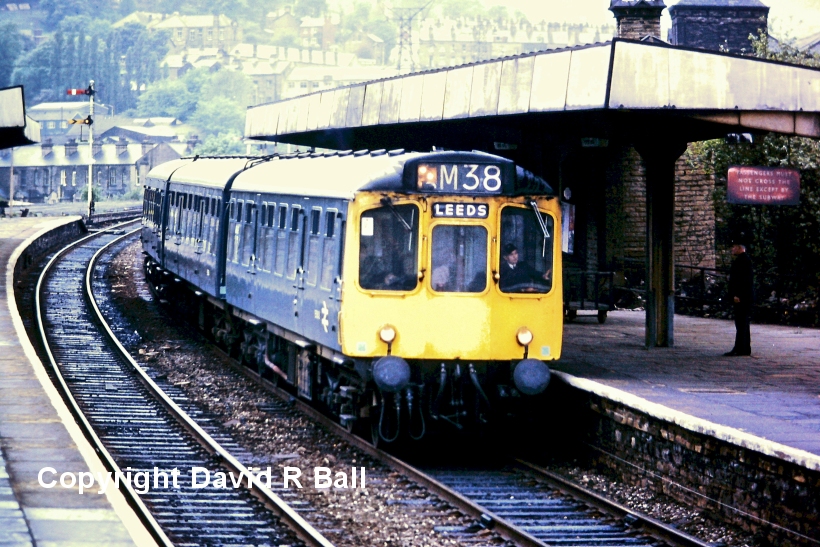 Sowerby Bridge railway station 1971: This looks like a 3-car Class 110 unit heading towards Leeds, but the windows of the third car clearly differ, and is probably a Metro-Cammell Class 101 or 111 car substituted for the Diving Motor. The Home Signal at the end of Platform is number 42, whilst the distant is worked by Sowerby Bridge East.