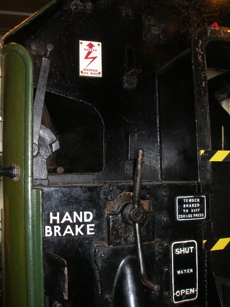 Stanier 'Coronation' Pacific 46235 'City of Birmingham' as seen in the ThinkTank Museum on 10 October 2015.  Fireman's side of tender front showing hand brake and coal pusher handles.