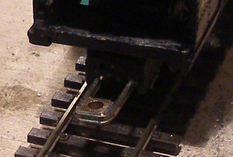 The rear drawbar on the loco is formed from a spare loco axlebox and more bullhead rail, which in turn is soldered to the brass frames of the loco chassis.