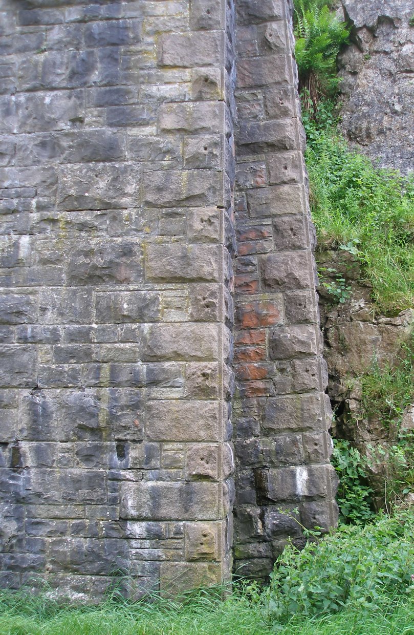 Tall bridge in rock cutting on the ex-LNWR line from Boxton to Ashbourne.