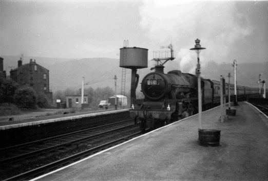 A Jubille powers a Lancashire-bound Sunday School excursion (1Z20) into Todmorden on an overcast day in 1963.
