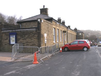 Todmorden Railway Station: three quarters view of southern wall of main station building  looking eastwards from car park on 19 April 2013
