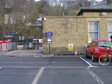 Todmorden Railway Station: sixth section of southern wall of main station building  westwards from entrance on 19 April 2013