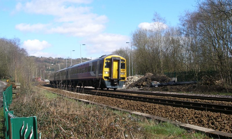 158.755 passes over Bridge 103 on Friday 25 March 2016 with service 2M44 11:51 Leeds to Rochdale departing Todmorden on time at 12:50 a.m.