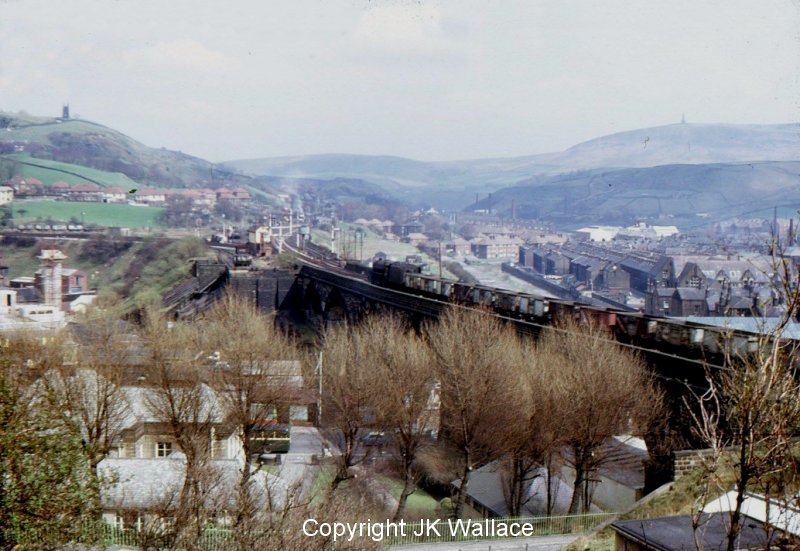 Todmorden Viaduct seen from above the station with Stanier Black 5 44803 heading eastwards with an empty mineral train purportedly in August 1968.