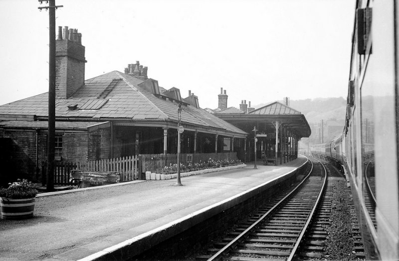 Todmorden Station Platform 1 in August 1955 from a train standing at Platform 2 showing the original platform buildings and canopy.