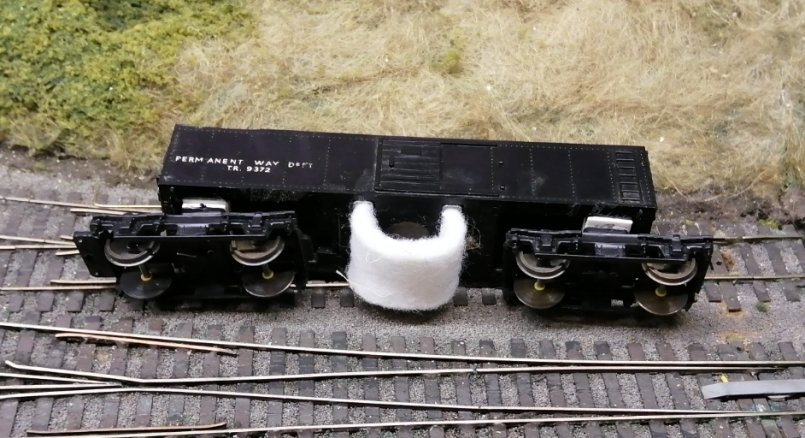 Triang OO track cleaning car re-bogied for Finescale running.